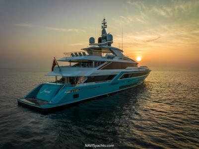 Turquoise 53-meter yacht Jewels gliding across the ocean, embodying luxury and elegance.