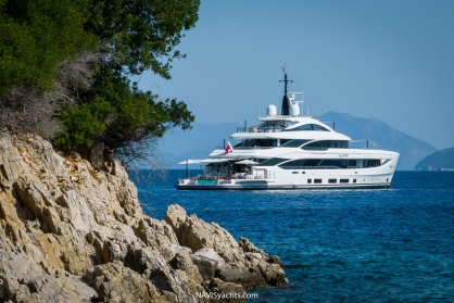 Alunya luxury yacht gleaming white facade under the sun