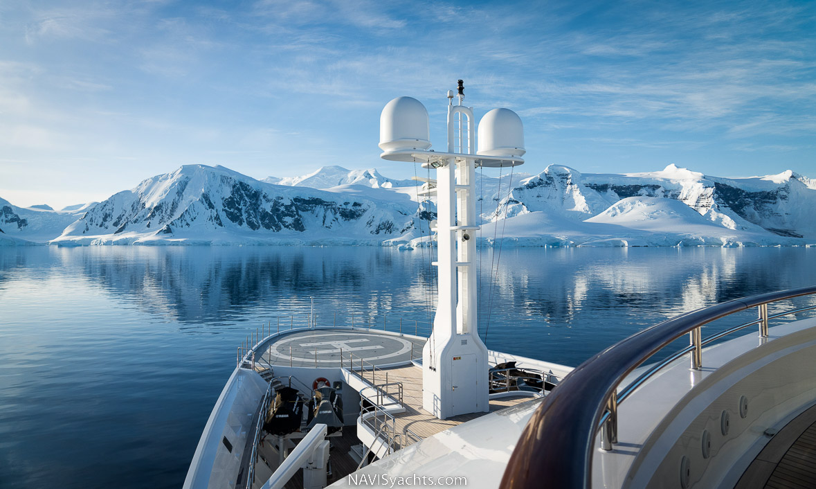 Lurssen Octopus sailing in the midst of stunning natural scenery.