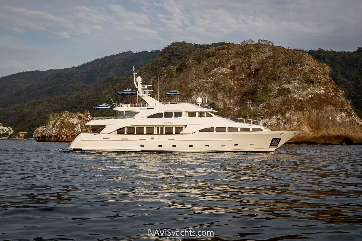 The splendid Felicità yacht, a shining example of Benetti series, at sea under the gleaming sun.