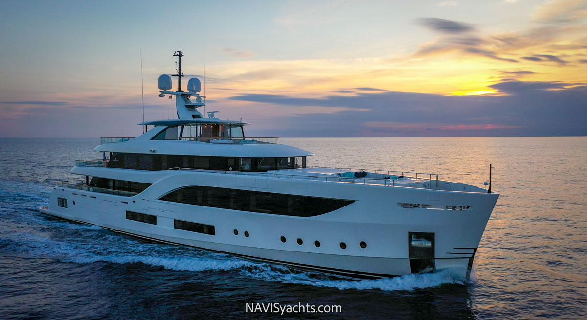 Sunset view of the luxurious 54.6m Baglietto C Superyacht sailing in the Western Mediterranean.