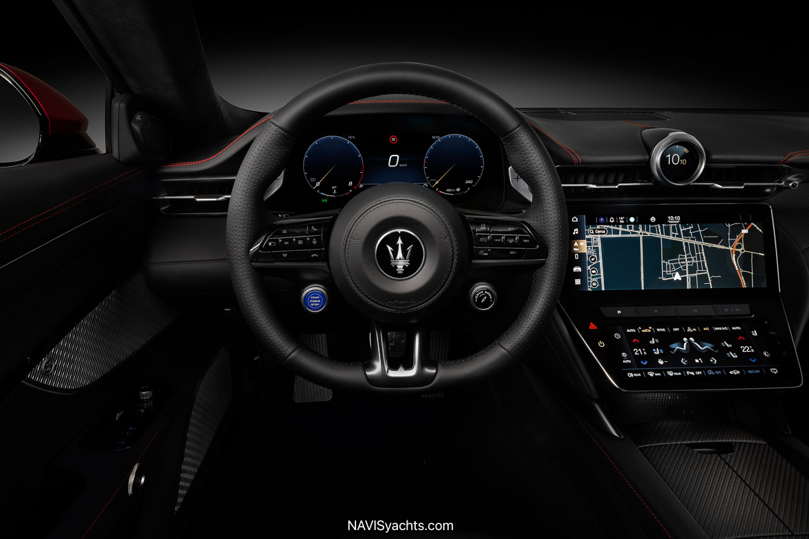 Inside the Maserati GranTurismo Trofeo, featuring luxurious leather seats and advanced technology dashboard.