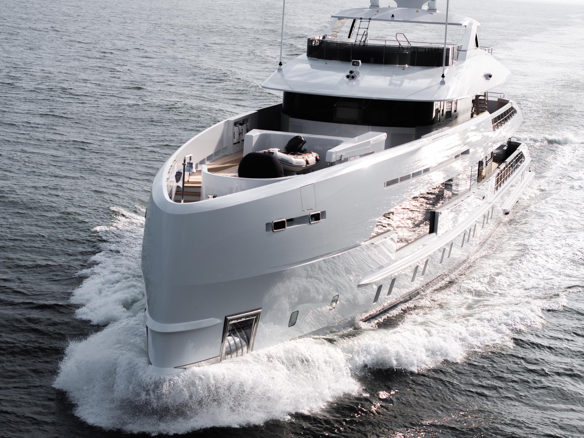The 50-meter Heesen hybrid superyacht ORION underway at sea, showcasing its sleek exterior lines by Omega Architects and a distinctive vertical bow