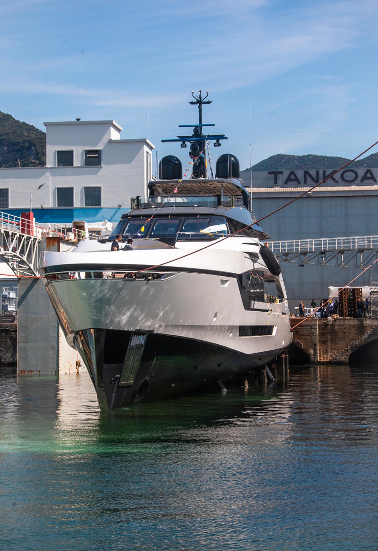 The new Tankoa 55 C115 superyacht, designed by Luca Dini, cruising on the water, showcasing its sleek lines and modern profile.