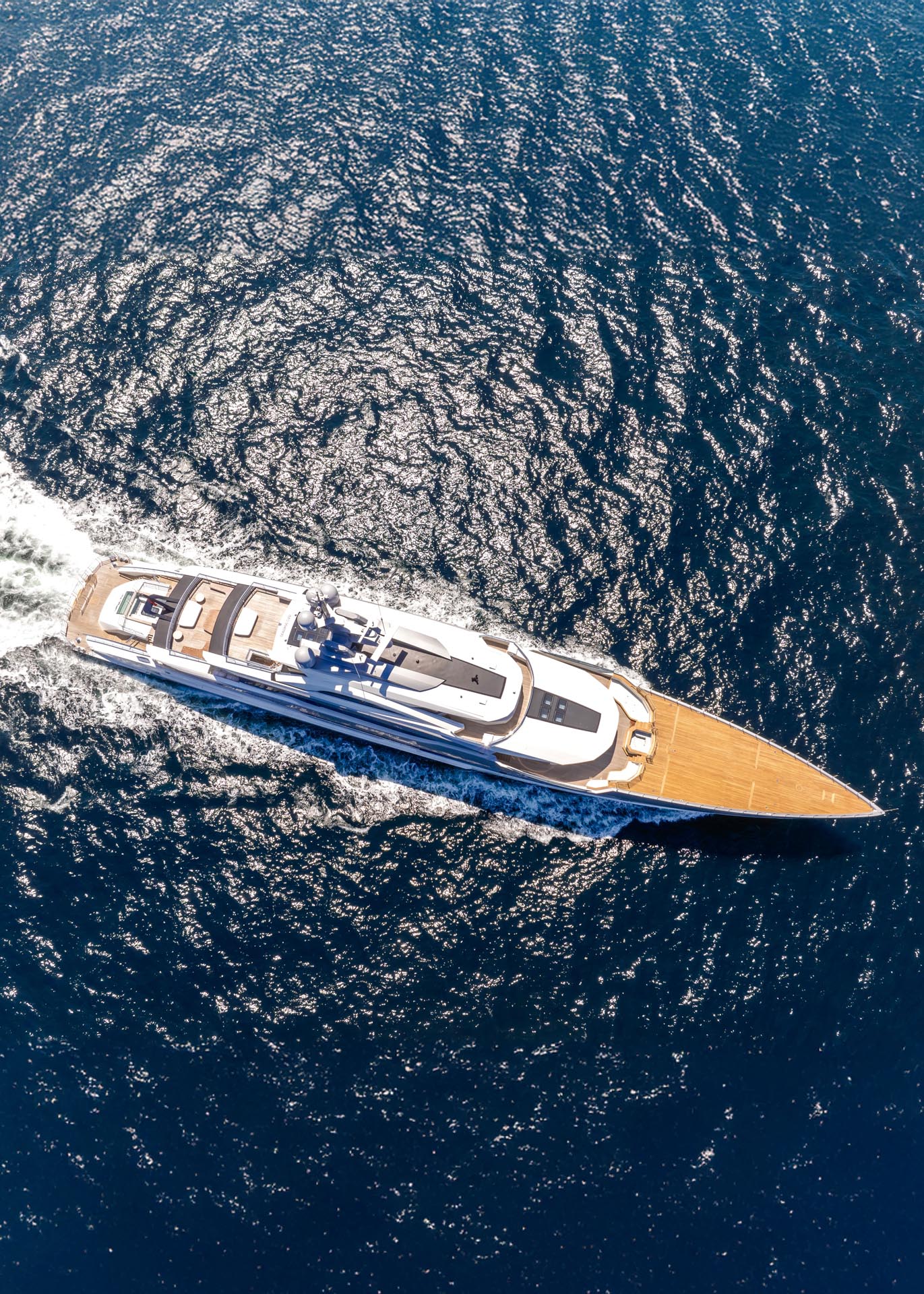 The 80-meter Bilgin superyacht M/Y Al Reem cruising on the open sea, seen from a starboard side profile angle under clear blue skies